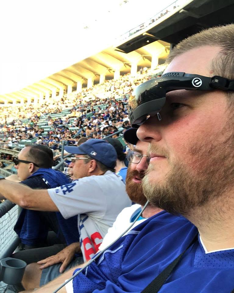 Cosmo Moore wearing his eSight 4 at a sports game.