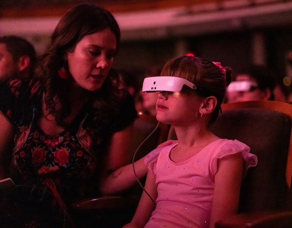 Little girl enjoys a concert using her eSight