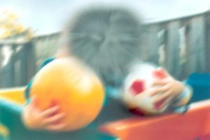 What someone with macular degeneration might see - blurred central vision, unable to make out a face.