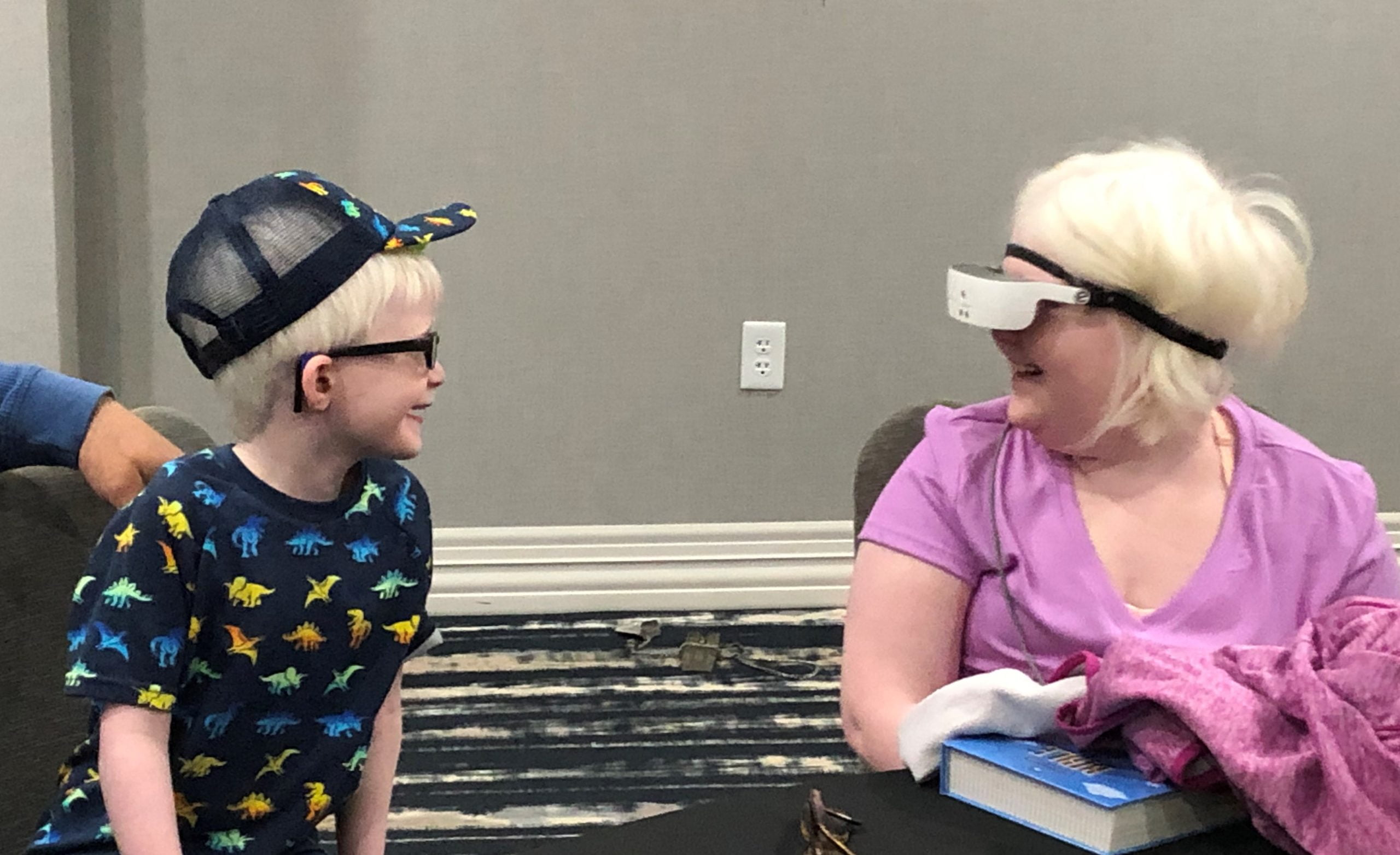 The Collins siblings look at each other's faces for the first time after living their entire lives with ocular albinism