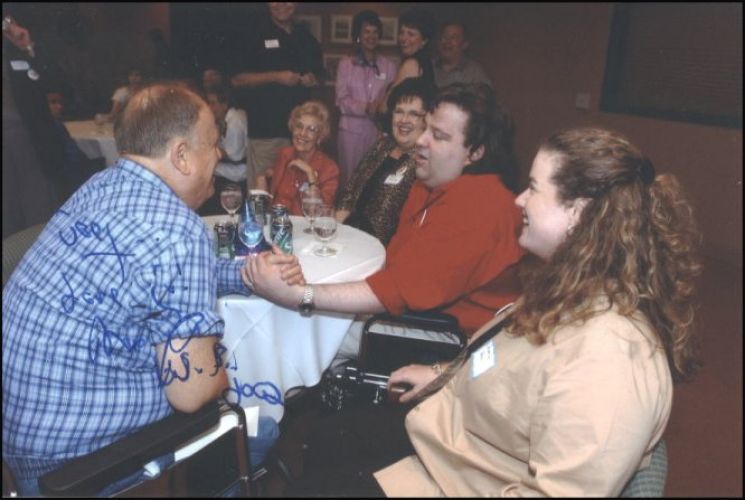 Joey Stuckey shaking hands with Max Cleland.