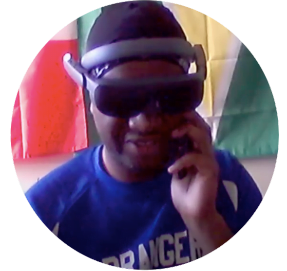 Jason seen wearing esight's high technology low vision aid while talking on the phone